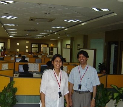 Dimple Gupta with a colleague on an early Damco office floor