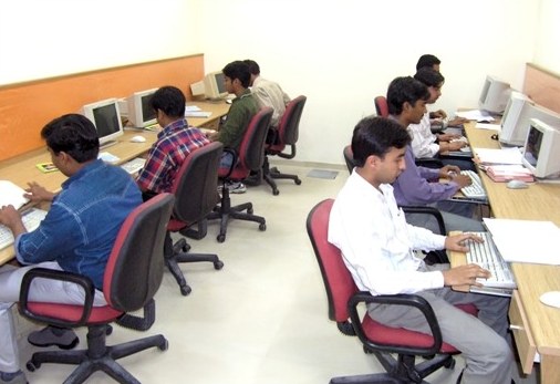 Engineers at a row of desktop computers