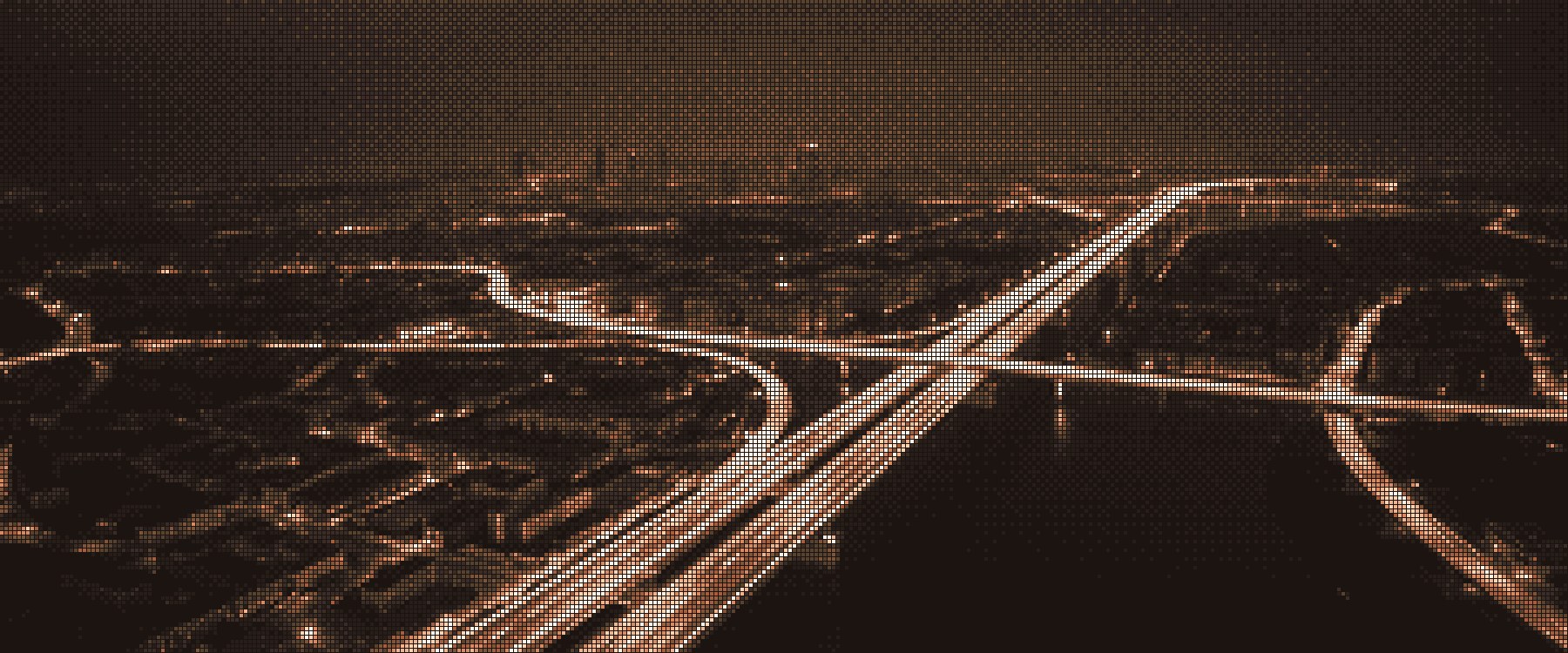 A city at night from above, its highways streaming with light, etched in bronze squares